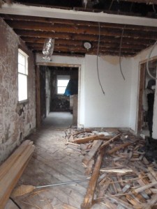 The gutted kitchen looking towards the living room.