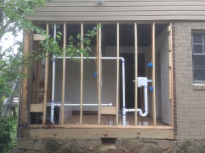 Figure 3. The gutted wall. The wall will be covered in structural sheathing, house wrap, and fiber-cement siding.  